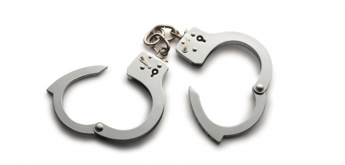 a pair of unlocked hand cuffs