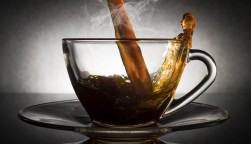coffee pouring into a clear glass cup
