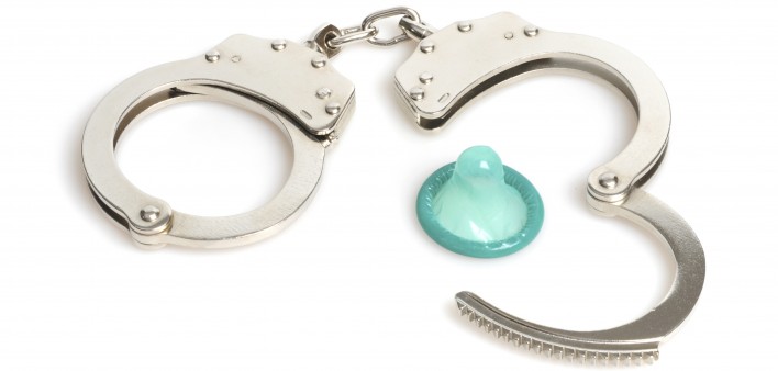 handcuffs and a blue condom