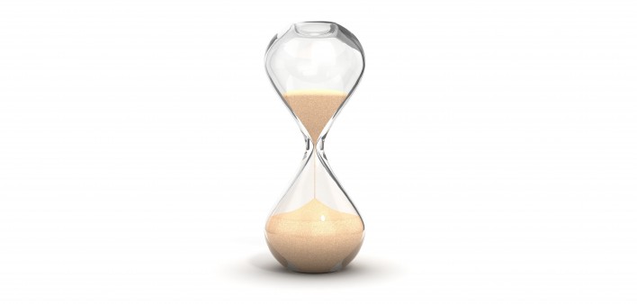 an hourglass with sand running downwards