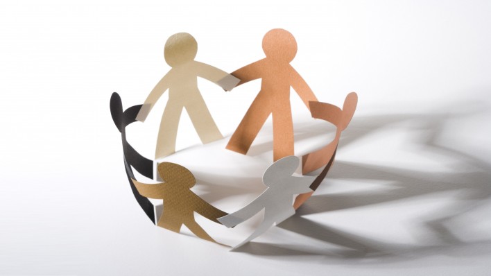 paper cut out dolls joined hands in a circle