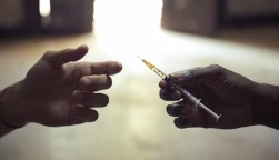 drug users passing a syringe