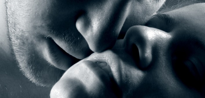 a man and woman about to kiss