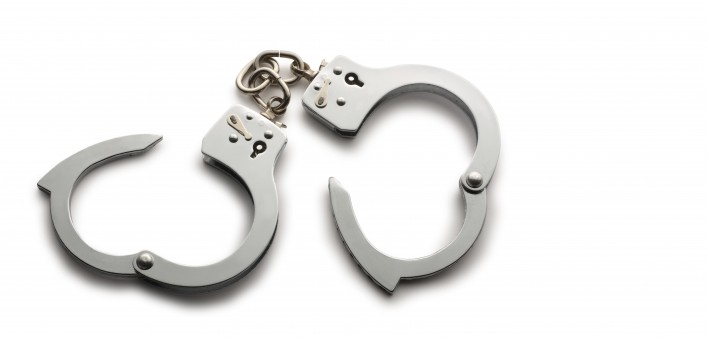 a pair of unlocked hand cuffs
