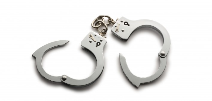 a pair of unlocked hand cuffs