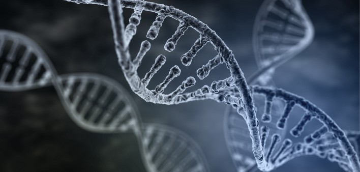  Spiral strand of DNA on a dark background