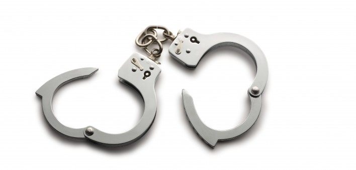 a pair of unlocked hand cuffs