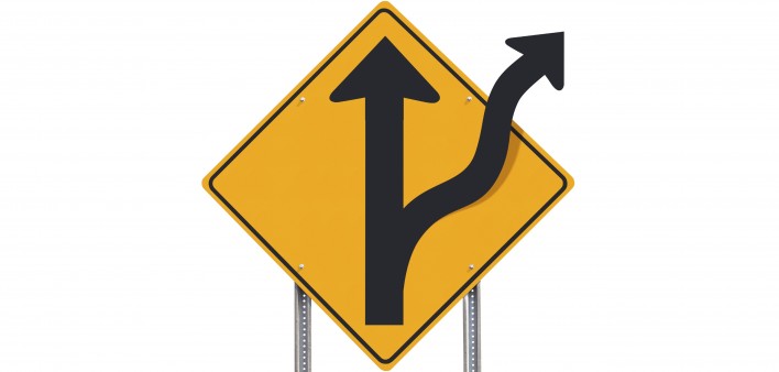 road sign showing road divides ahead