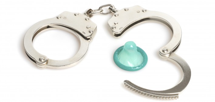 handcuffs and a blue condom