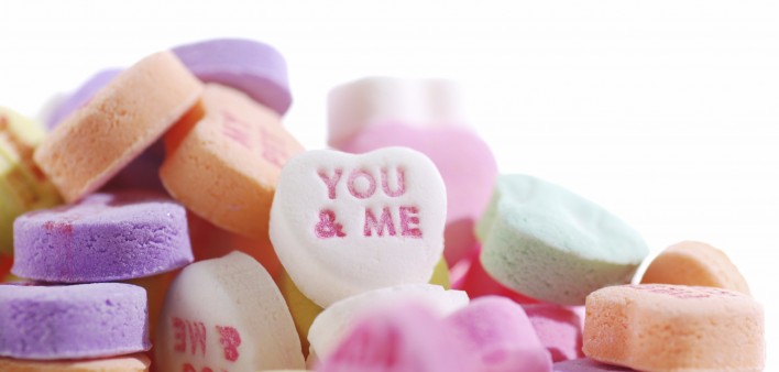 Valentine's candy hearts with the words YOU & ME