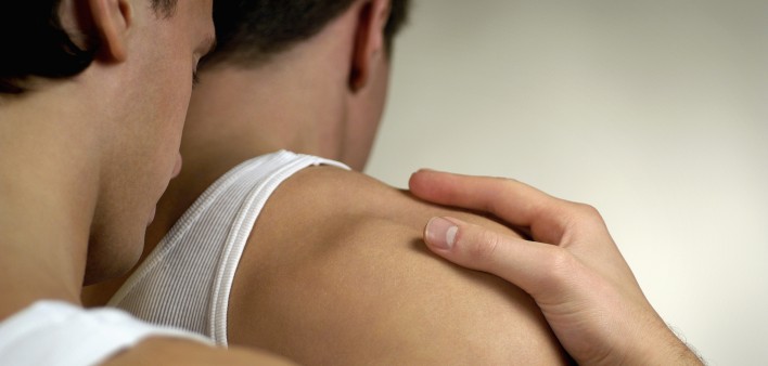 One gay man holding another