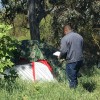 A member of the VA Central California Health Care System’s Hepatitis C Clinic approaches a homeless person’s tent in Fresno, Calif.