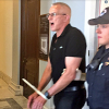 GMHC’s Eric Sawyer getting arrested at Senator McConnell’s office