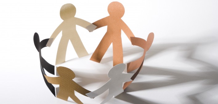 paper cut out dolls joined hands in a circle