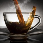 coffee pouring into a clear glass cup