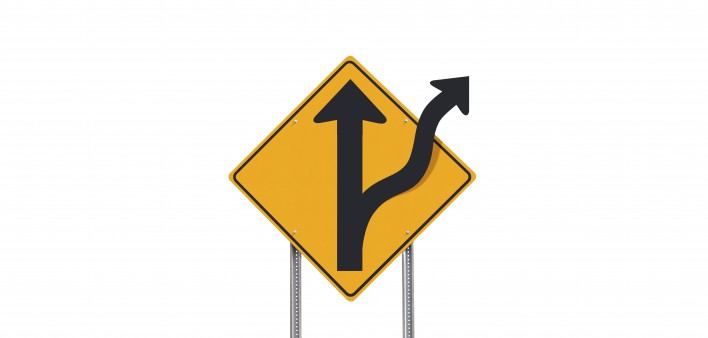 road sign showing road divides ahead