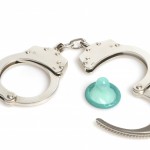 handcuffs and a blue condom