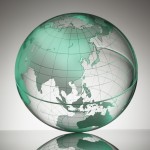 a transparent globe showing Asia