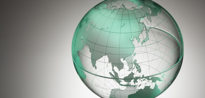 a transparent globe showing Asia