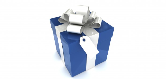 a blue gift box with a white ribbon