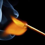 igniting match and smoke