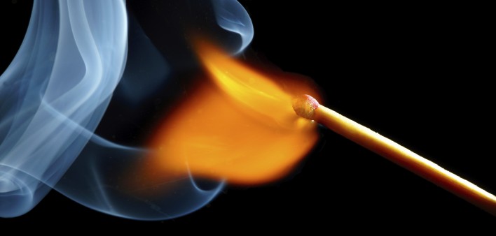 igniting match and smoke