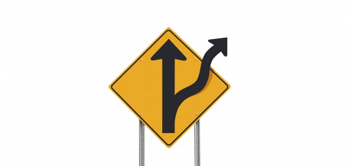 road sign showing road divides ahead