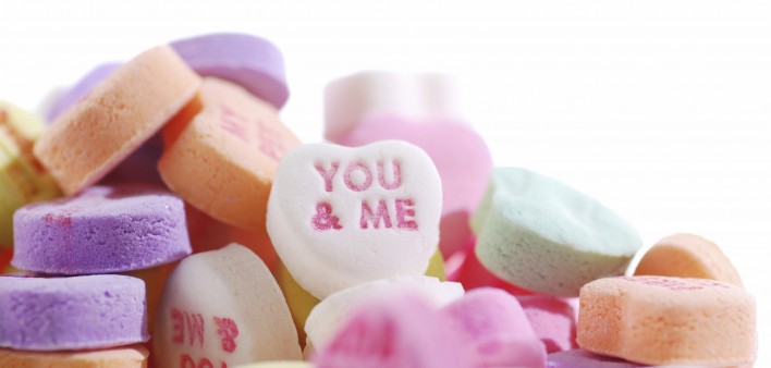 Valentine's candy hearts with the words YOU & ME