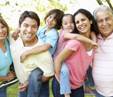 A multi-generational latin family having fun outdoors