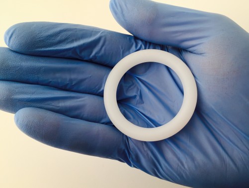 Dapivirine vaginal ring on blue gloved hand