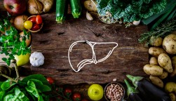A table of food with a drawing of a liver