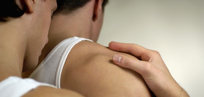 One gay man holding another