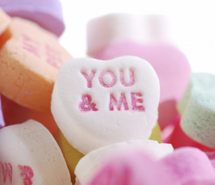 Valentine's candy hearts with the words YOU & ME