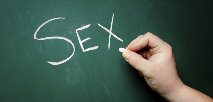 "SEX" being written on a blackboard