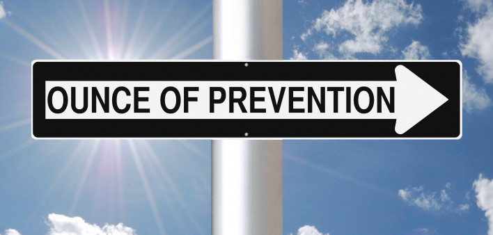 Ounce of Prevention sign against a blue sky