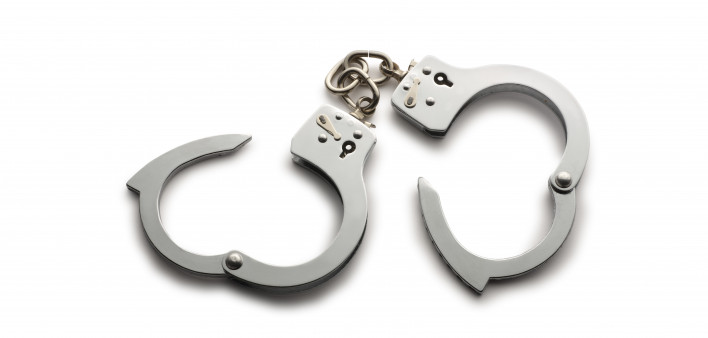 a pair of unlocked hand cuffs