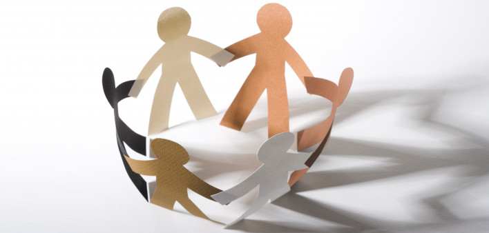 paper cut out dolls joined hands in a circle