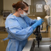Senior Airman Leah Costell manually washes a colonoscope prior to placing it in a high-level disinfection machine Sept. 2, 2015, at the Wilford Hall Ambulatory Surgical Center, Joint Base San Antonio-Lackland.