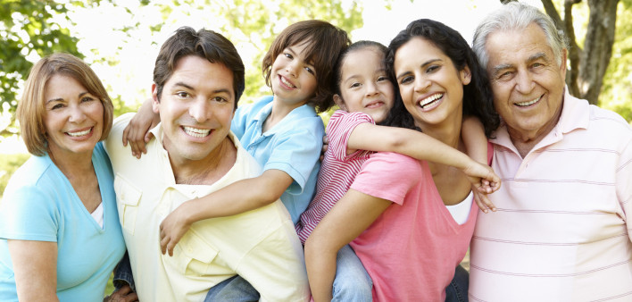 A multi-generational latin family having fun outdoors