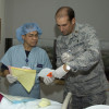 At Wilford Hall Medical Center, staff registered nurse Roland Bautista (center) and Maj. (Dr.) Dustin Stevenson, medical director for bone marrow transplants, prepare to give Christine Jackson (left) a stem cell transplant from a matching unrelated donor.
