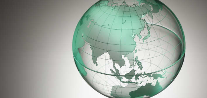 a transparent globe showing Asia