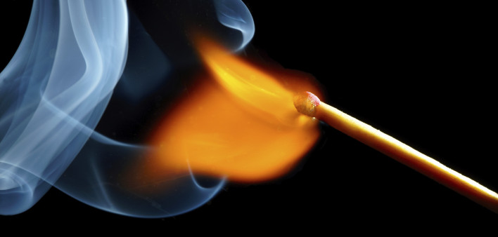 igniting match and smoke