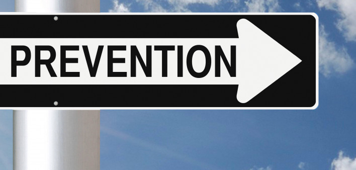 Ounce of Prevention sign against a blue sky