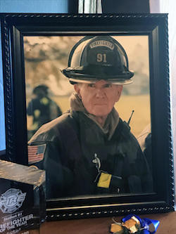 This is one of several photos in Steve Dillman's Indianapolis home that show his life as a firefighter.