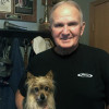 Steve Dillman, holding his 11-year-old yorkie Colt, stands in front of some of his old firefighting gear. The 74-year-old spent 38 years as an Indianapolis firefighter, and was diagnosed with prostate and throat cancers, most likely due to his profession.