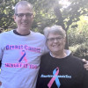 John Falk and his wife and two awesome shirts
