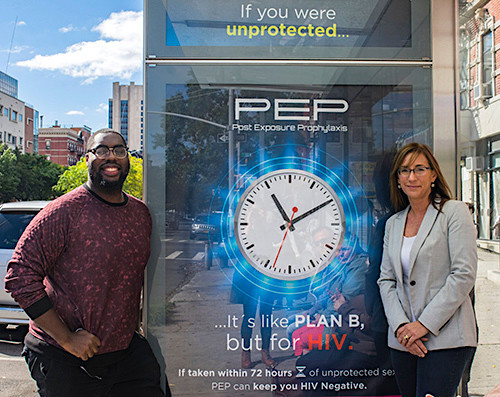 From left: Jeremy Fagan and Victoria Frye in front of a PEPTALK ad