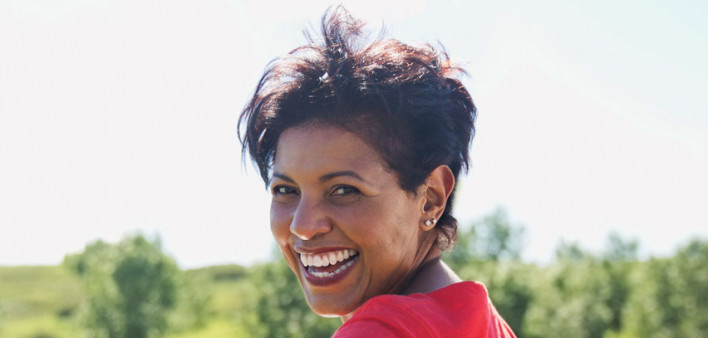 Portrait of playful woman running on the beach