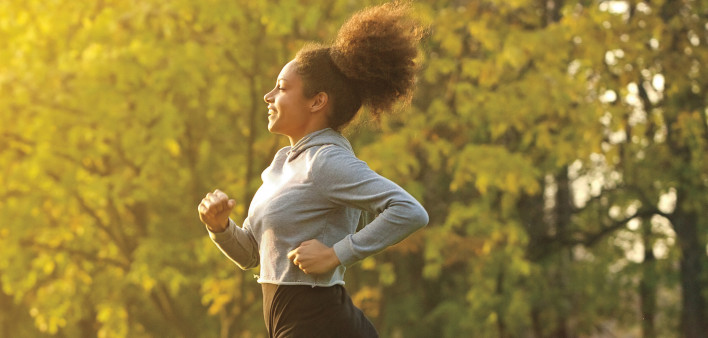 young woman running outdoors