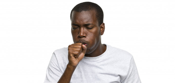 African-American man coughing